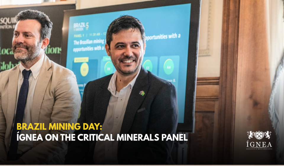 Giancarlo Silva smiling during the first panel at Brazil Mining Day, in front of the panel slide. Title: Brazil Mining Day: Ígnea on the Critical Minerals Panel.